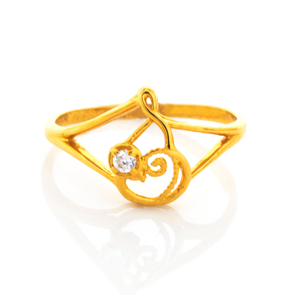 Gold ring with a diamond on a white background