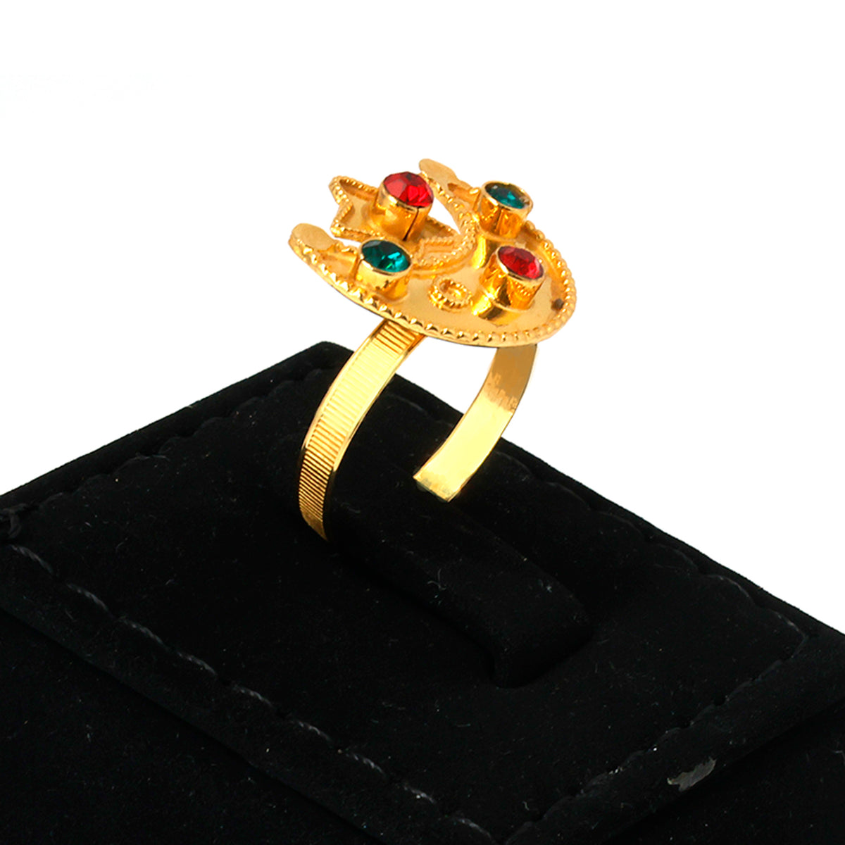 Gold ring with colored stones on a black velvet stand