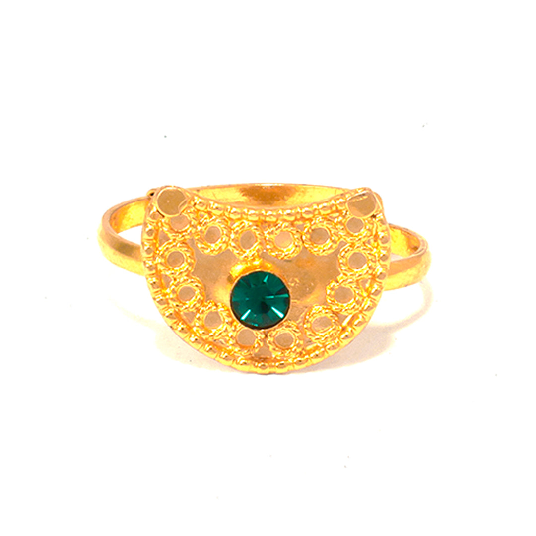 Gold ring with a green gemstone on a white background