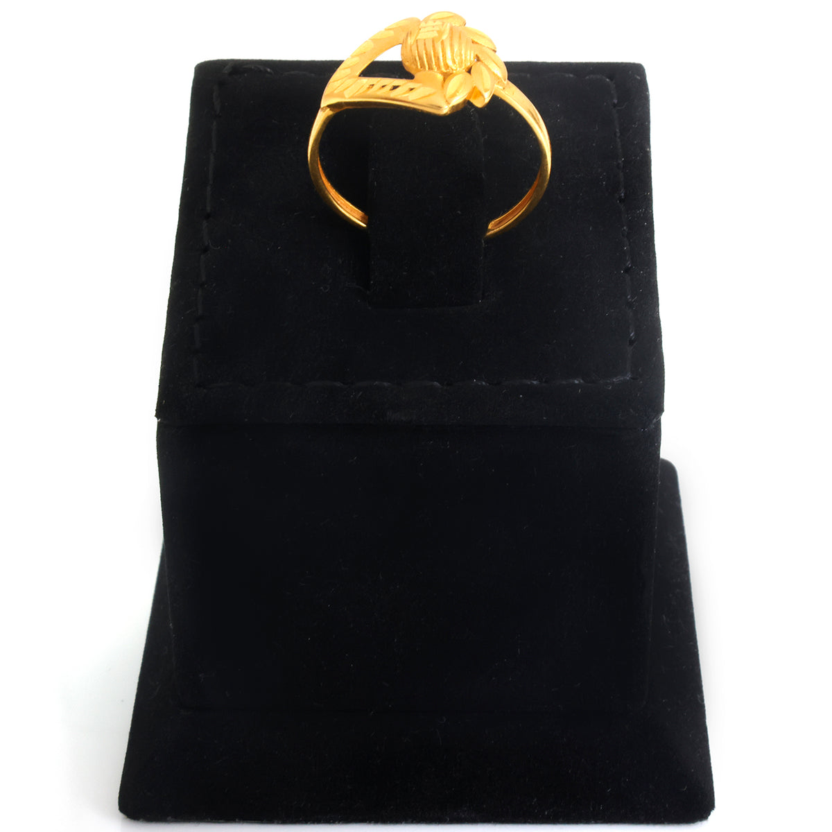 A gold ring with a knotted rope design on the band, displayed on a black velvet ring box against a white background.