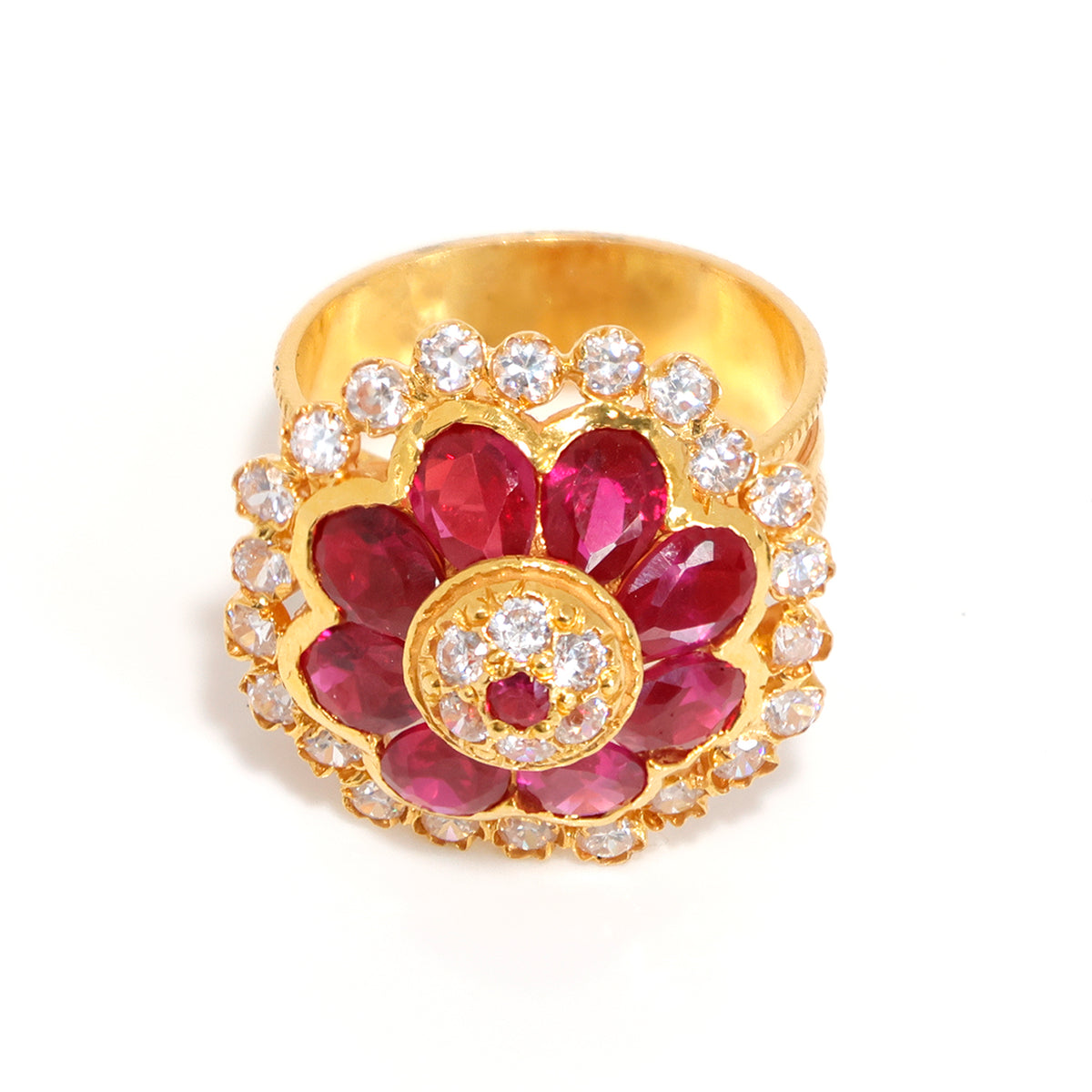 Gold ring with red gemstones and clear stones on a white background