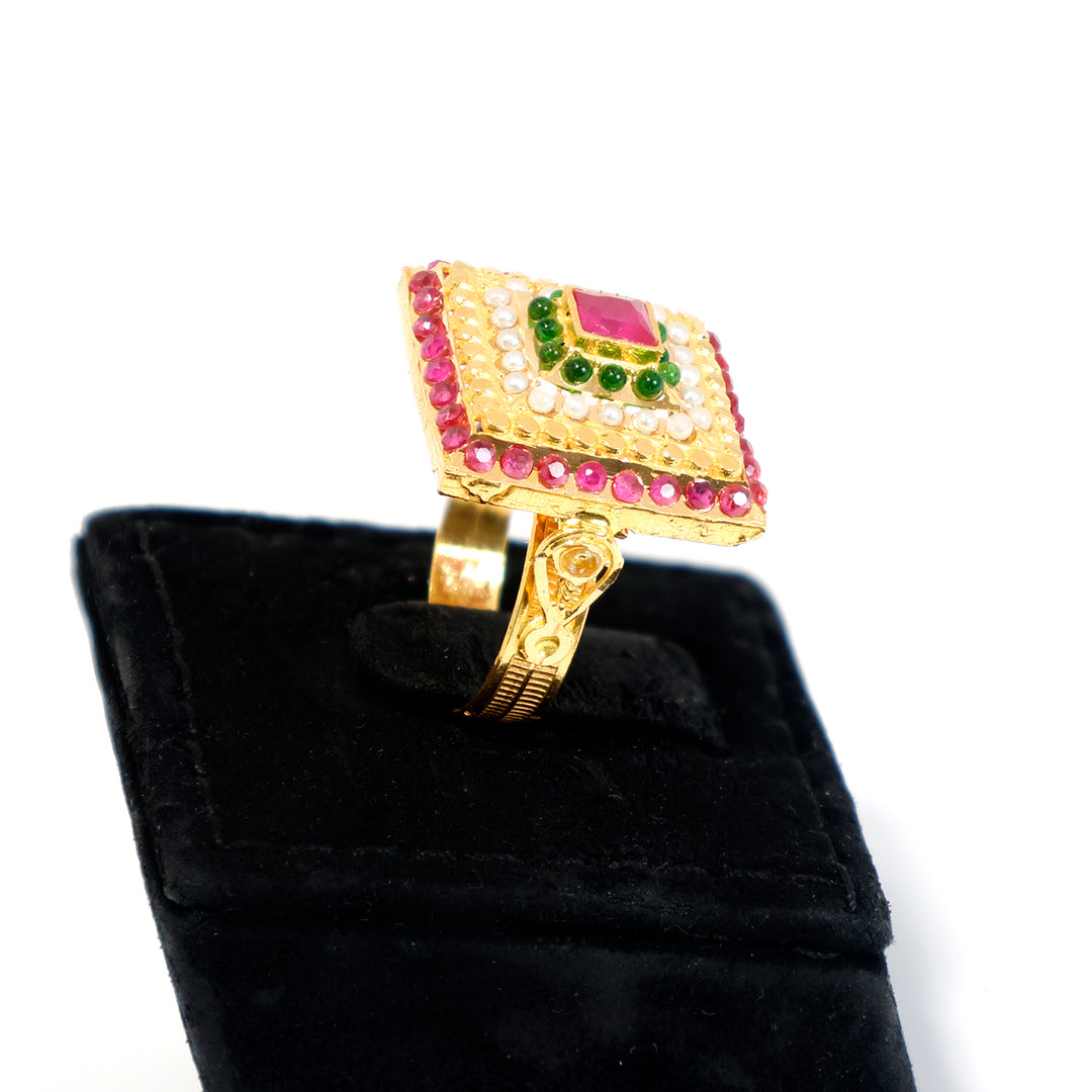 Gold ring with gemstones on a black velvet stand - zero making charge