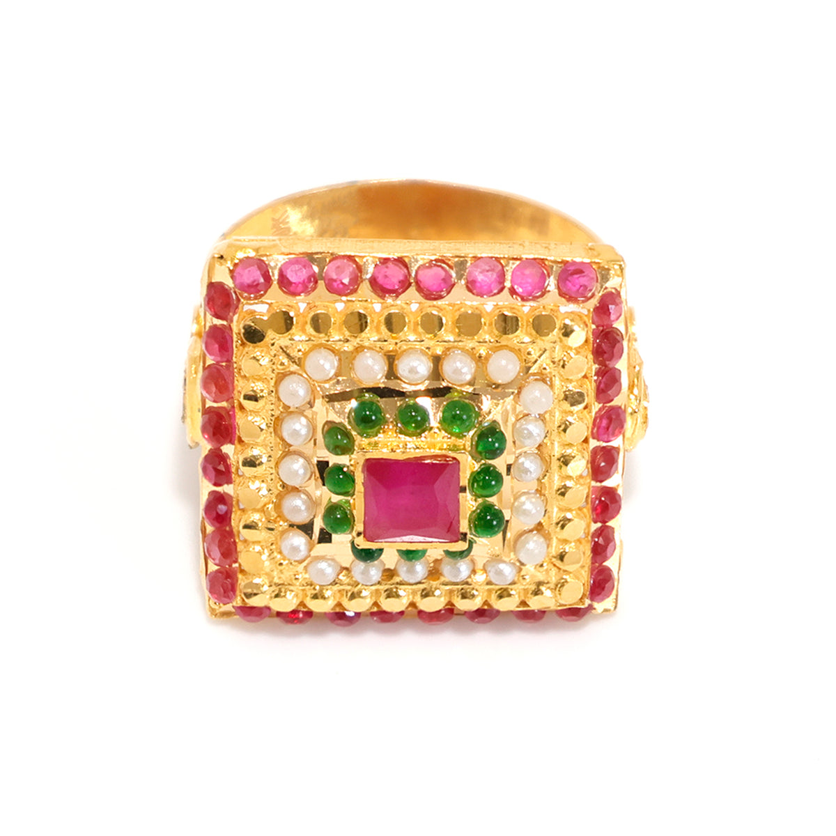 Gold ring with red gemstone and green stones on a white background