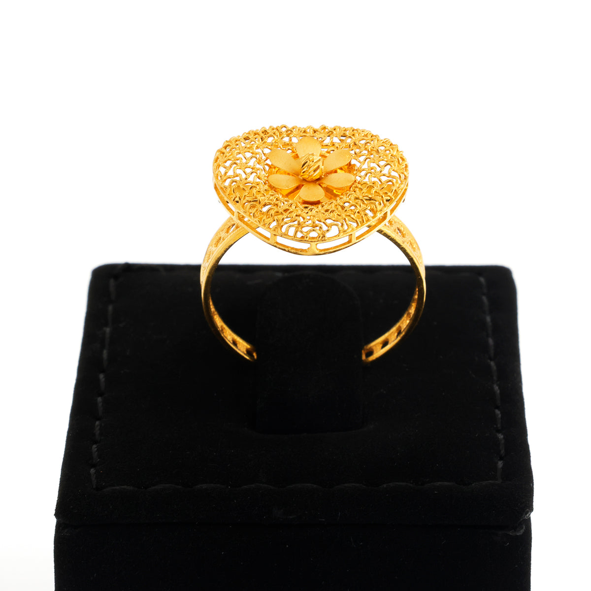 Gold ring with floral design on a black velvet stand