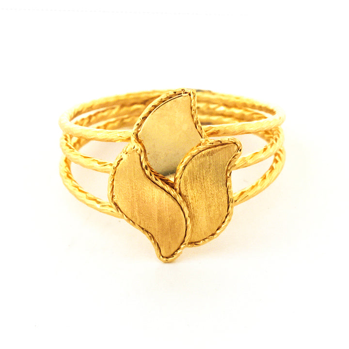 Gold ring with leaf design on a white background