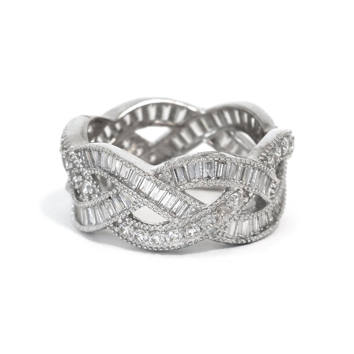 Silver ring with diamond accents on a white background