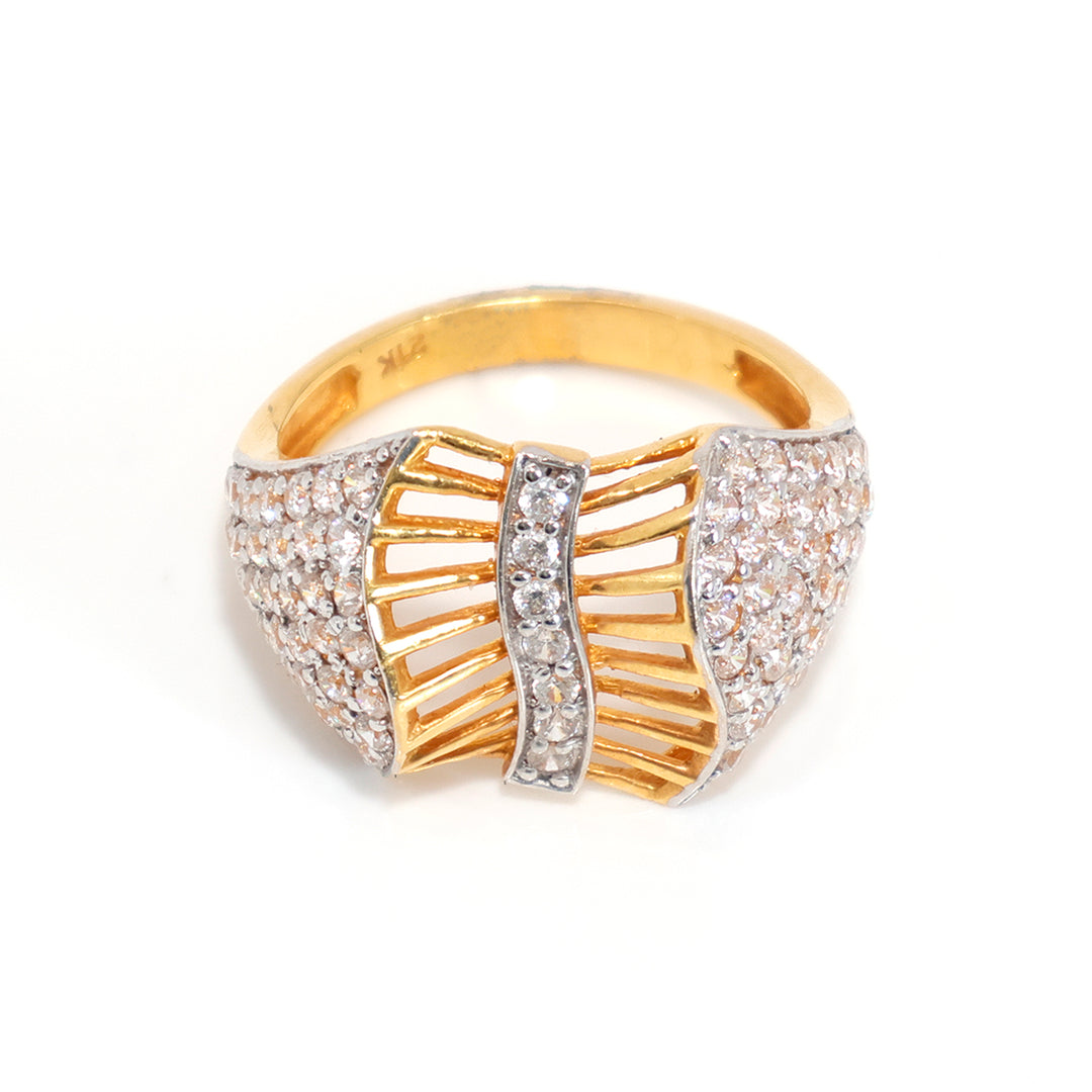 Gold and silver ring with diamond accents on a white background