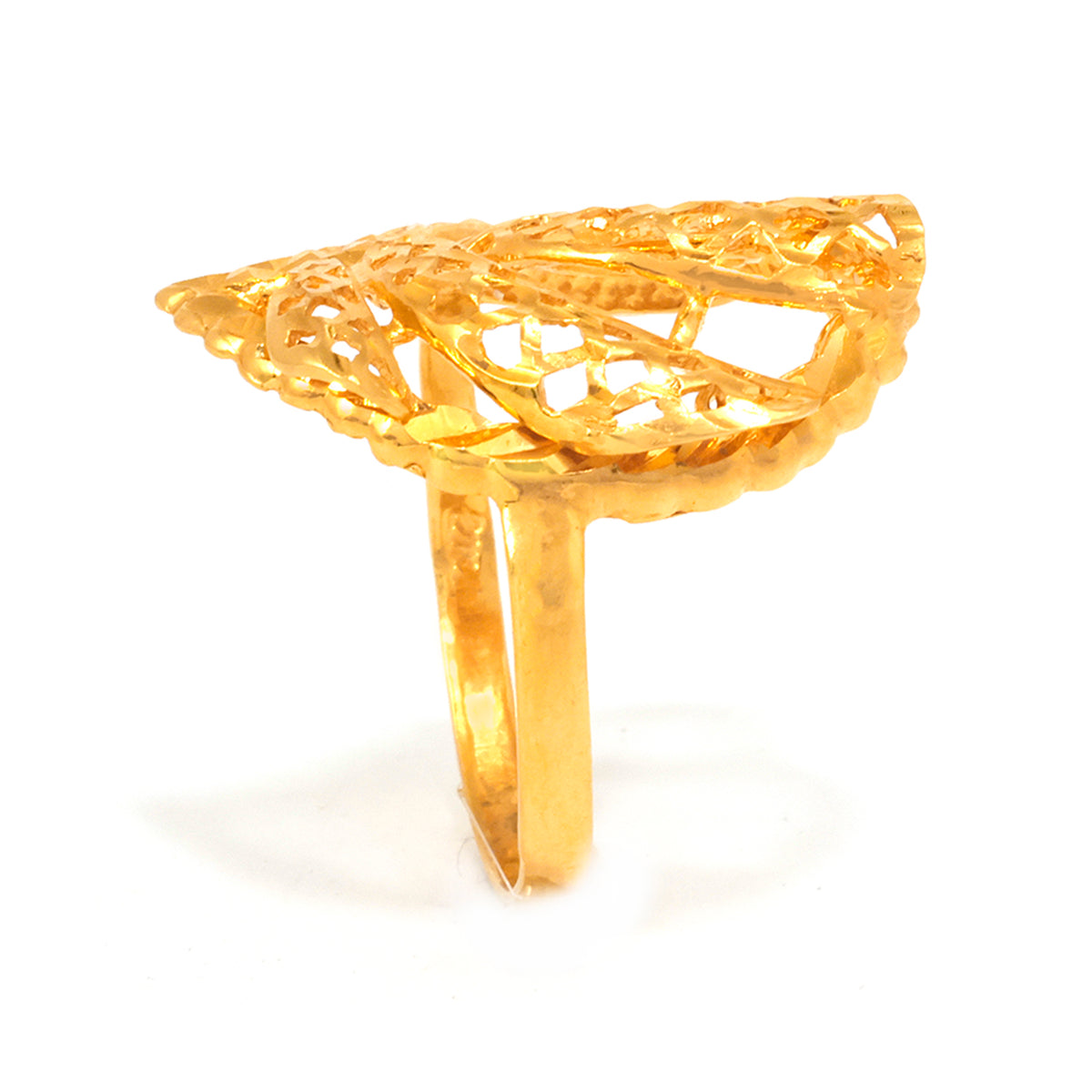 Gold ring with intricate design on a white background