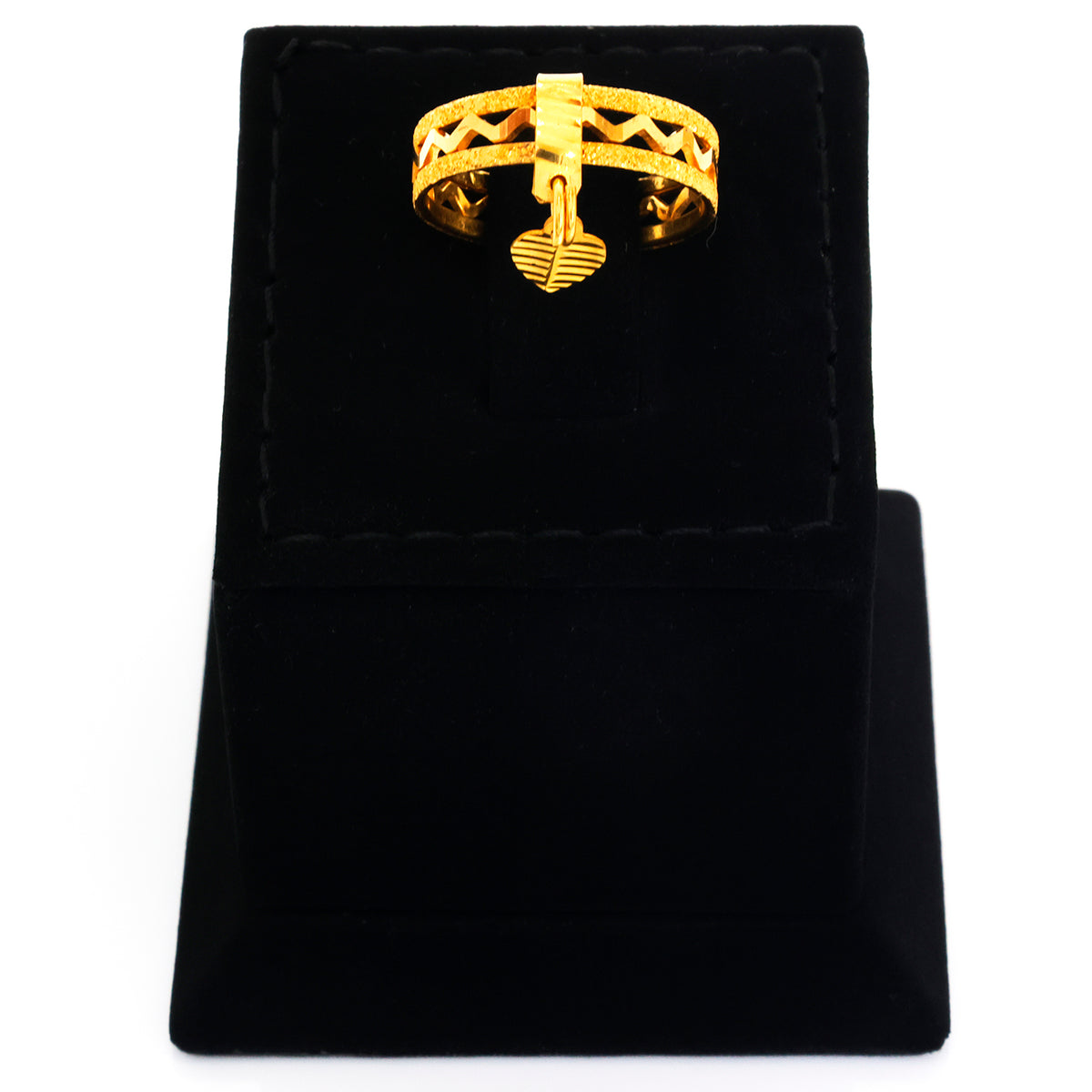 Gold ring on a black velvet stand with a white background