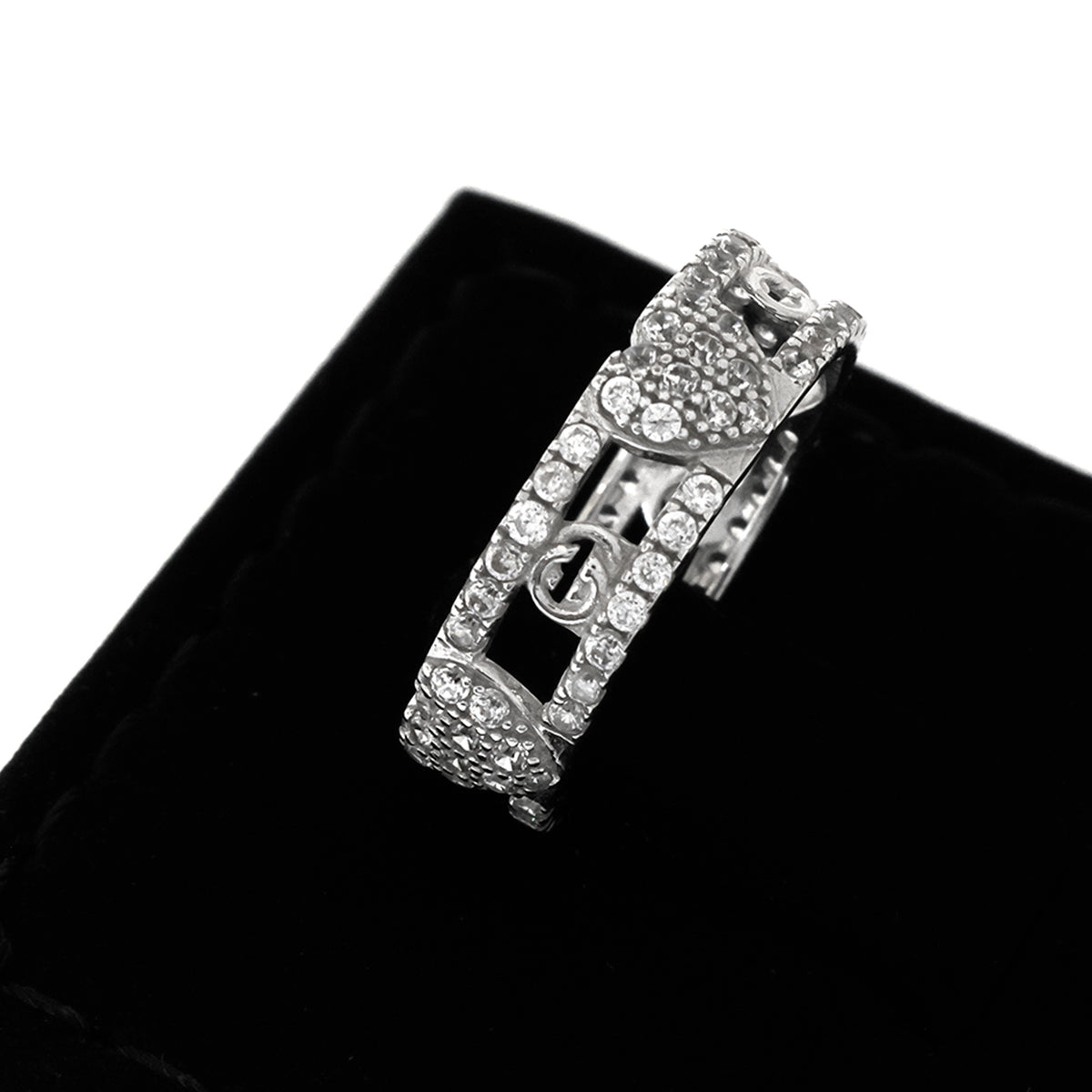 Silver bracelet with clear stones on a black cushion