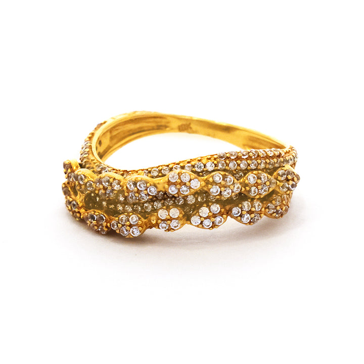 Gold ring with diamond accents on a white background