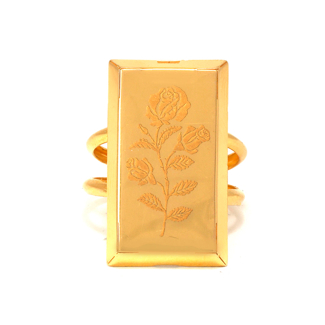 Gold ring with engraved rose design on a white background