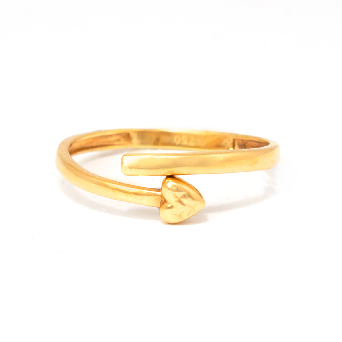Gold open ring with a heart-shaped charm on a white background