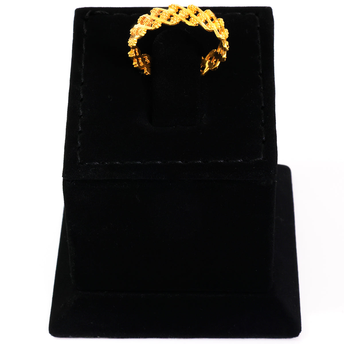 Gold ring on a black velvet stand