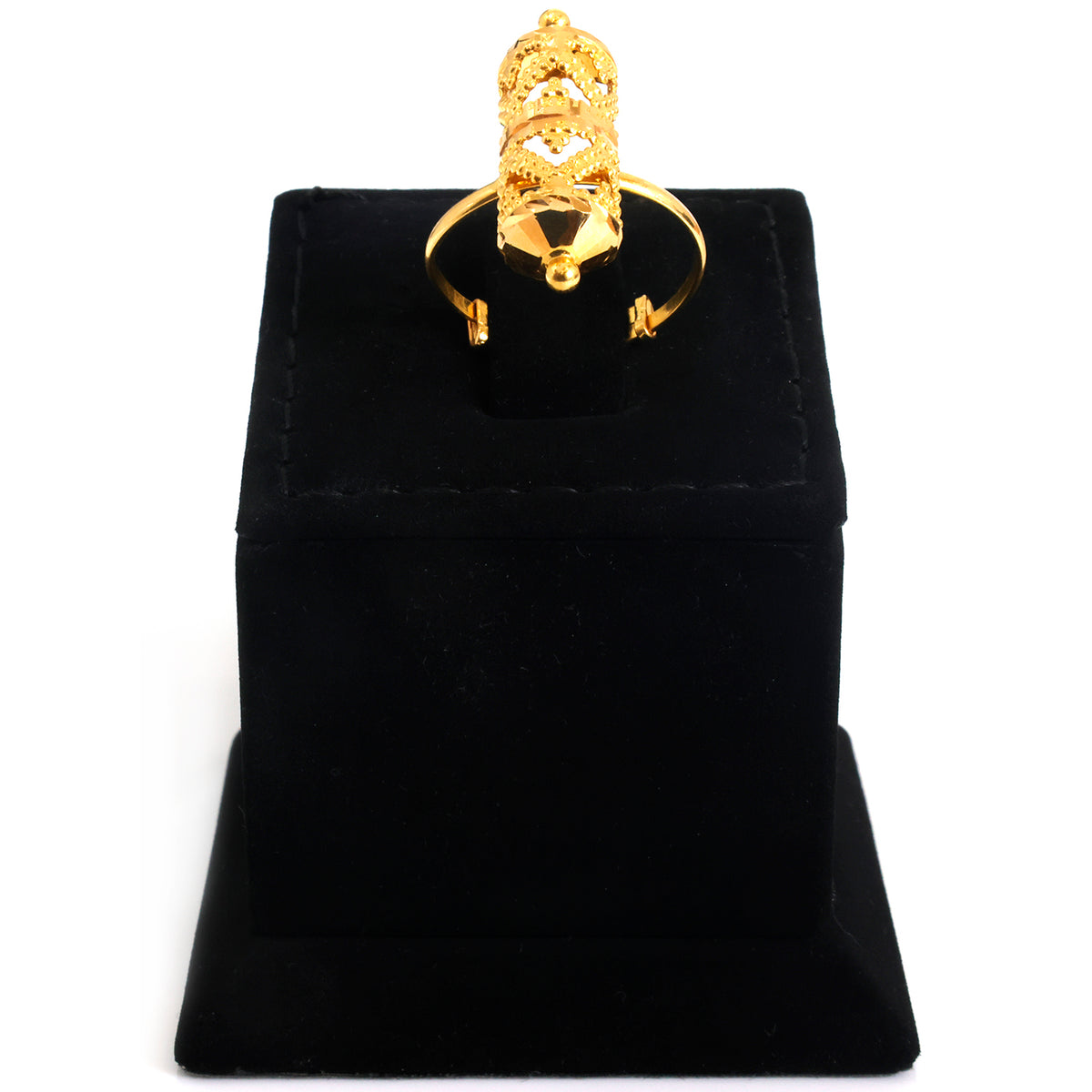 A gold ring with a highly detailed, tiered crown-like setting displayed on a black velvet ring box against a white background.