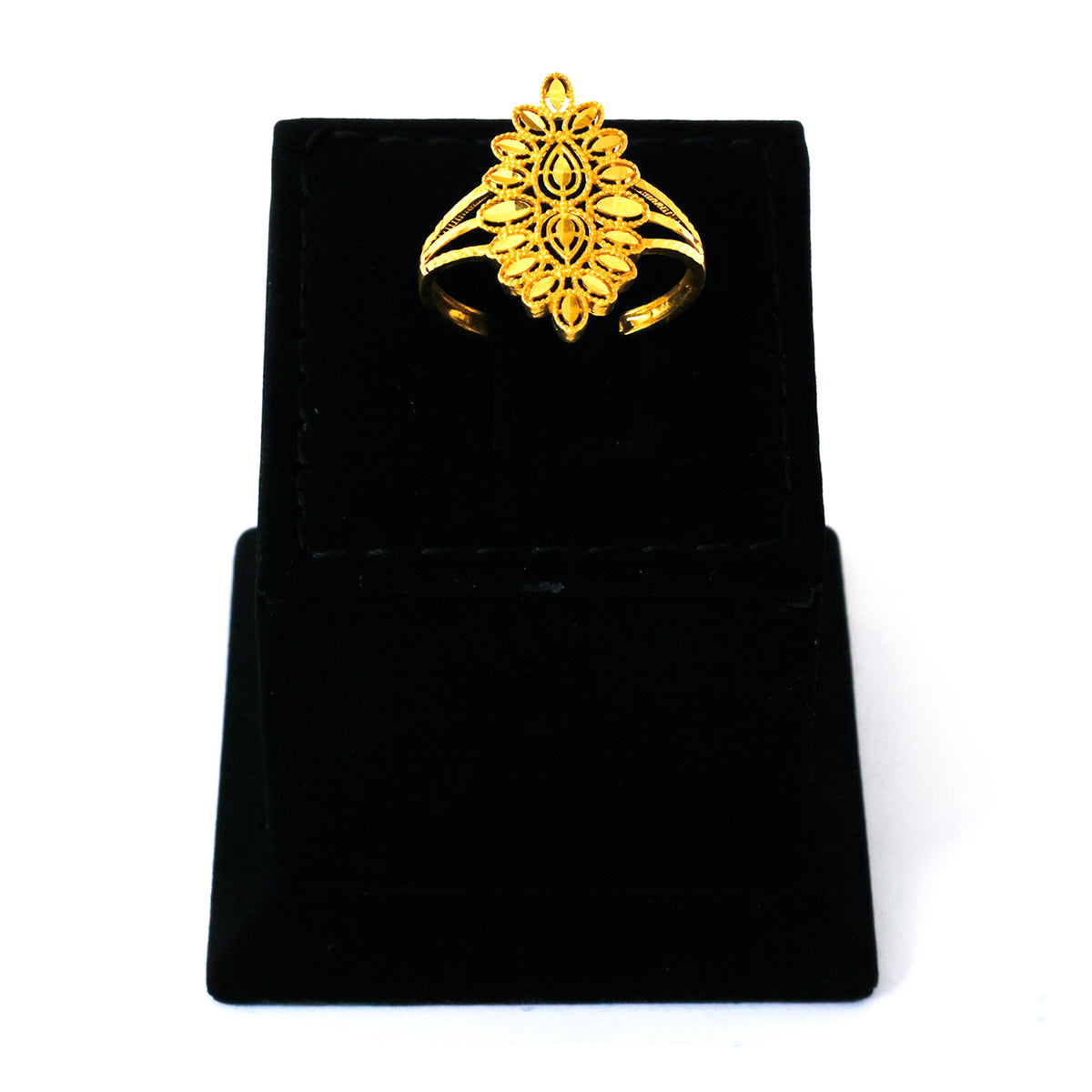Gold ring with intricate design on a black velvet stand