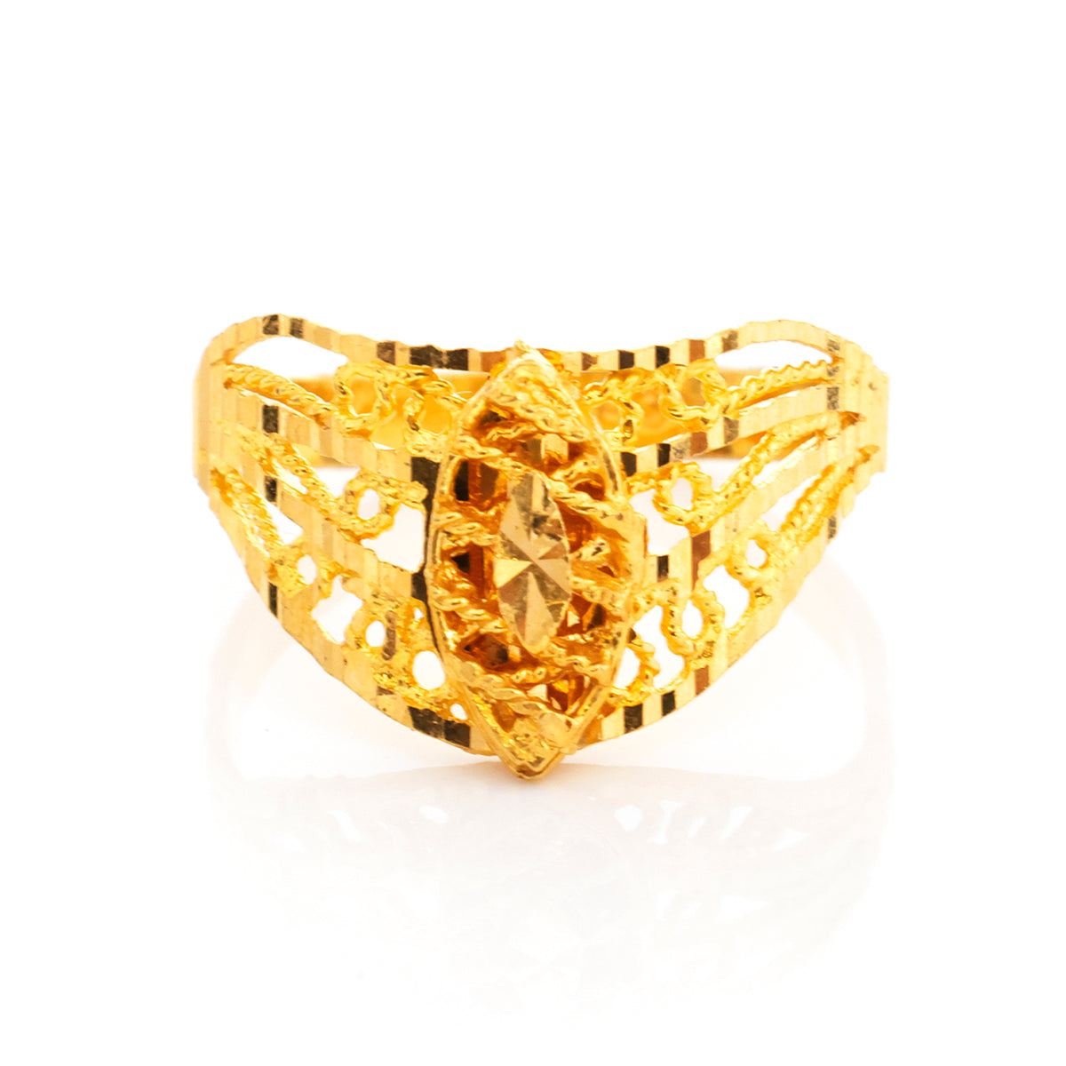 Gold ring with intricate design on a white background