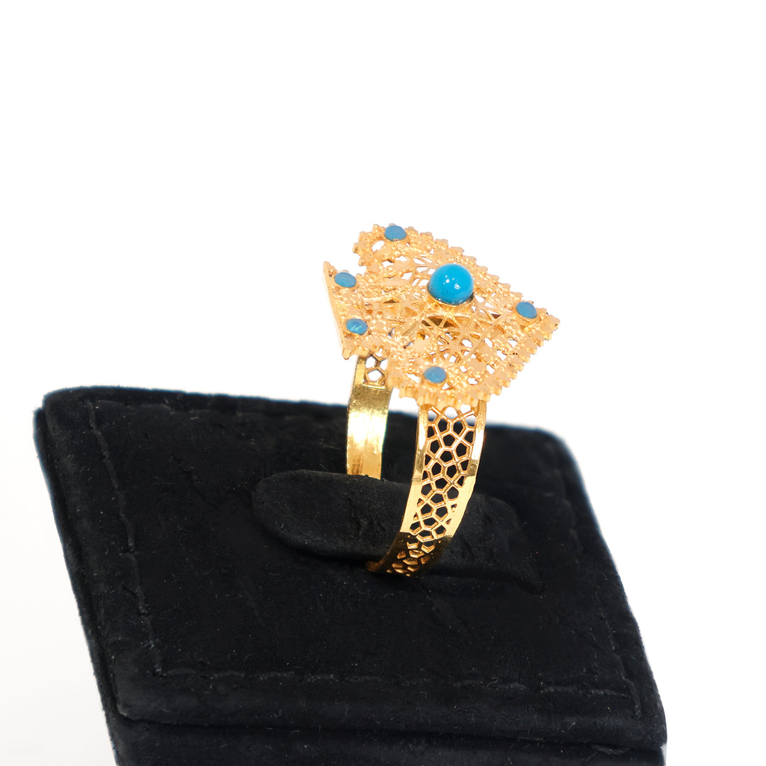 Gold bracelet with turquoise stones on a black velvet stand - zero making charge
