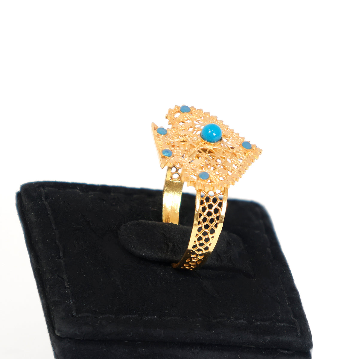 Gold bracelet with turquoise stones on a black velvet stand - zero making charge