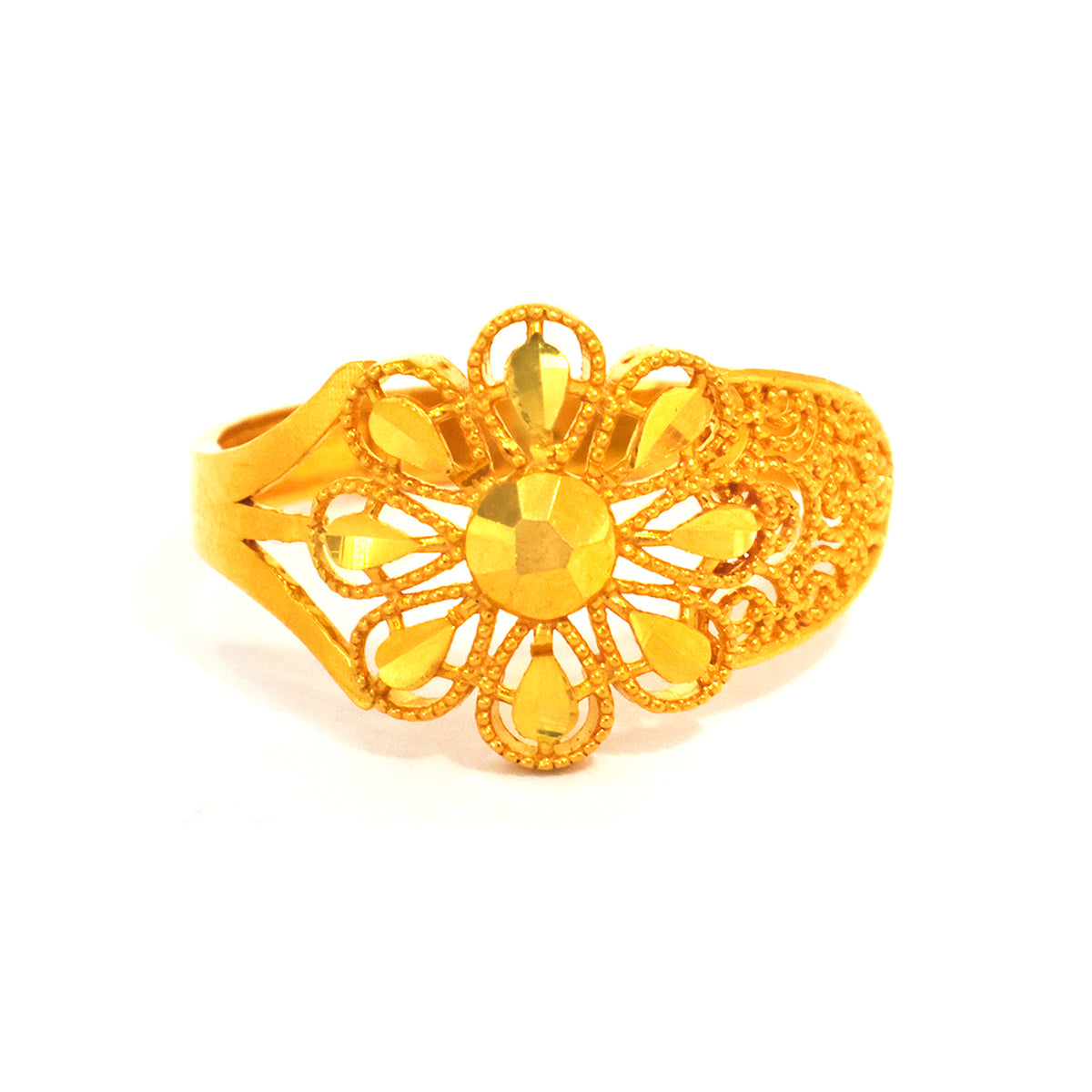 Gold ring with floral design on a white background