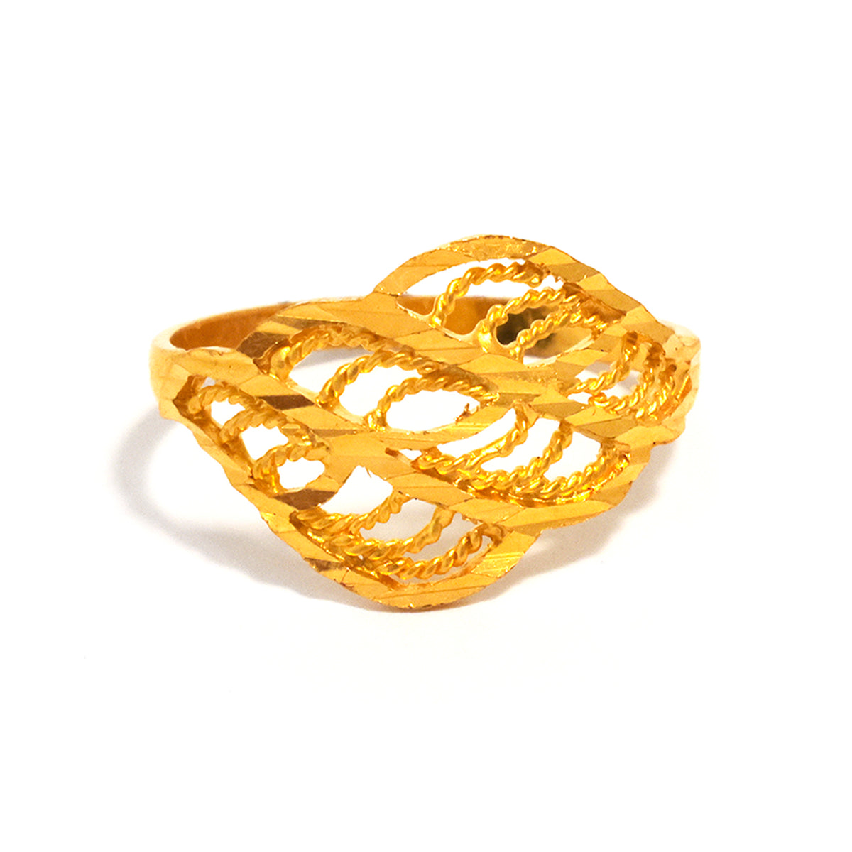 Gold ring with intricate design on a white background