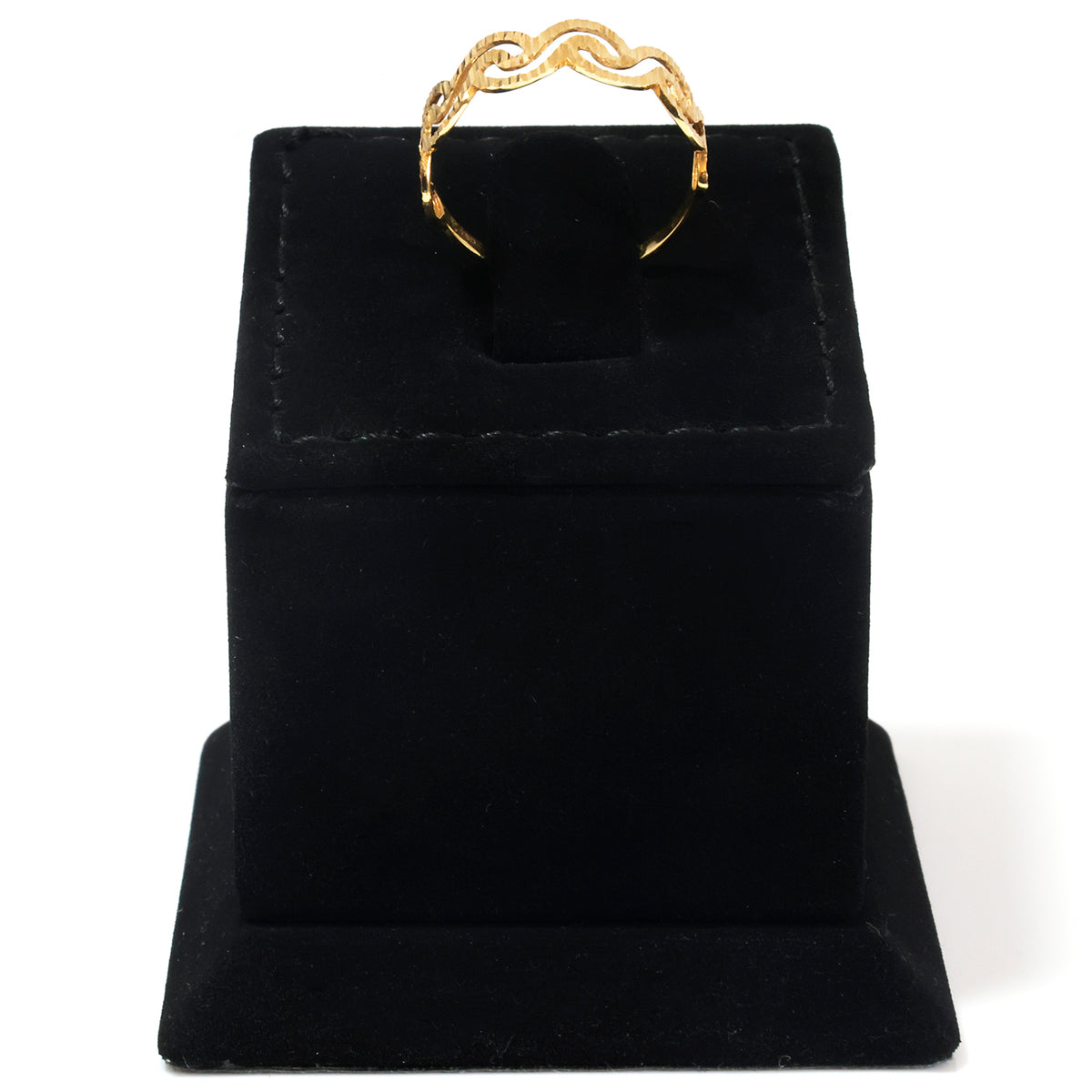A gold ring with a wavy, linked design displayed on a black velvet jewelry stand against a white background.