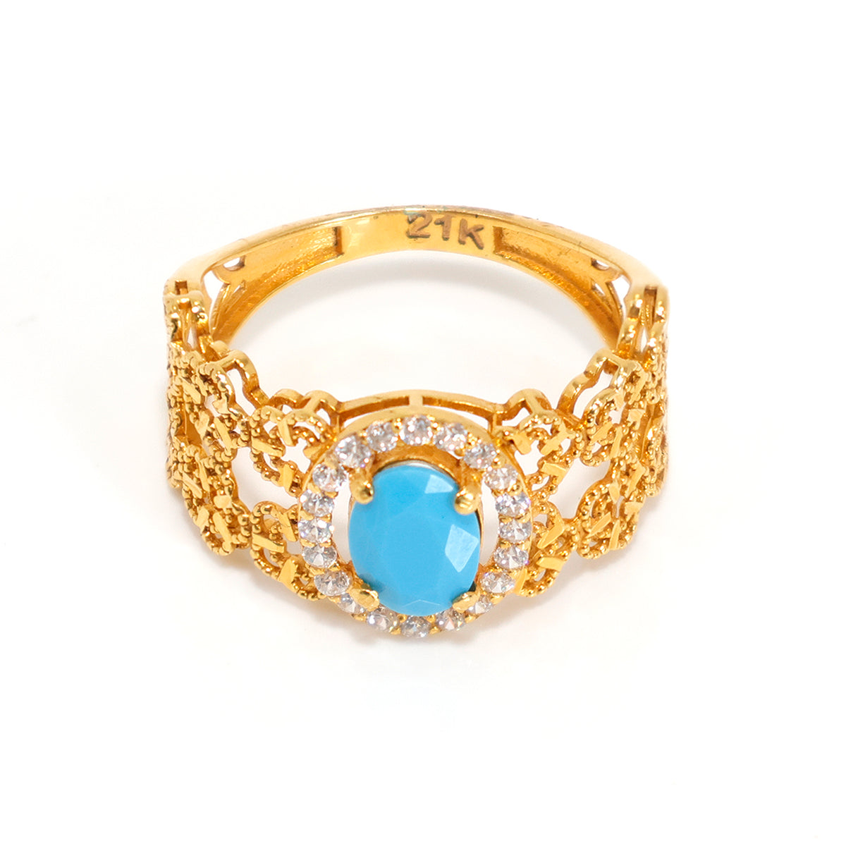 Gold ring with a blue gemstone and diamond accents on a white background