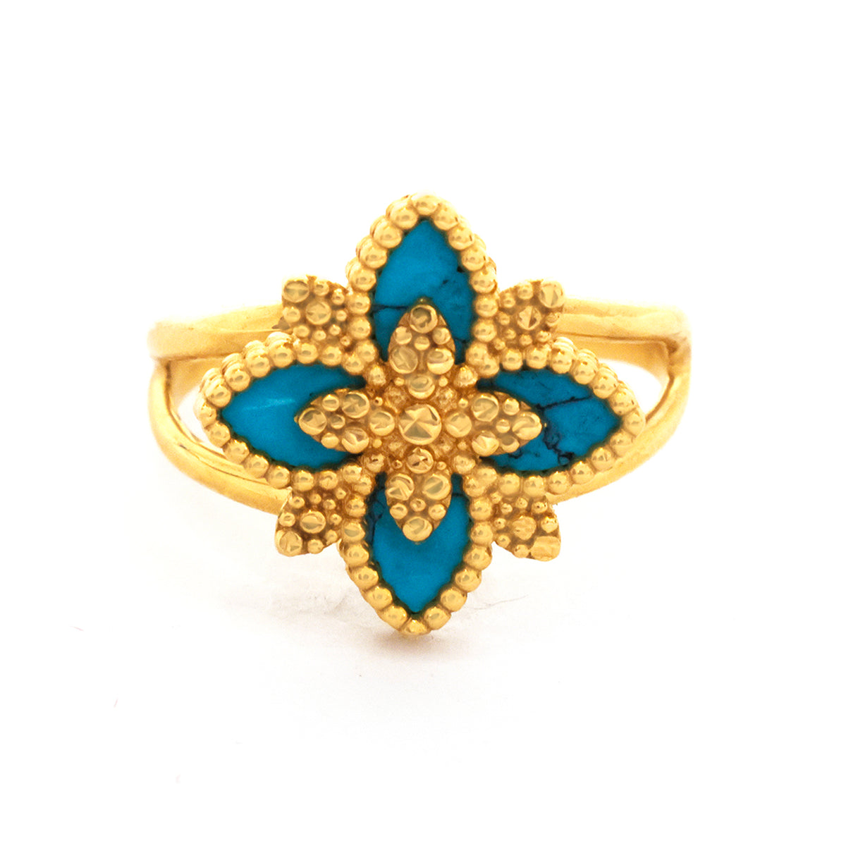 Gold ring with blue floral design on a white background