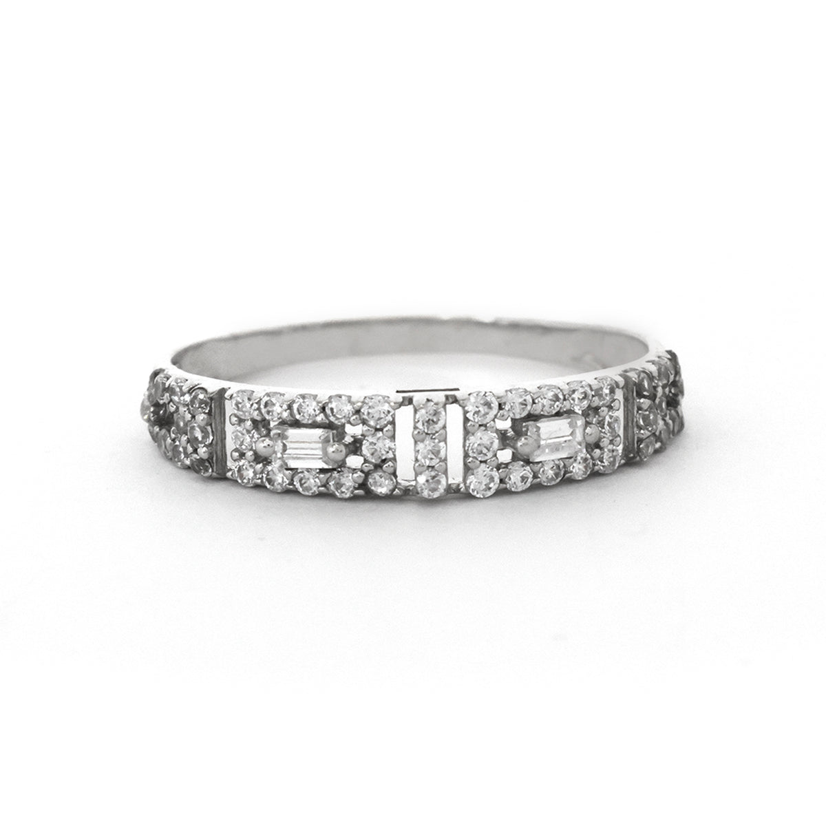 Diamond ring with baguette and round cut stones on a white background