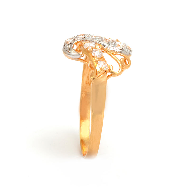 Gold ring with diamond accents on a white background