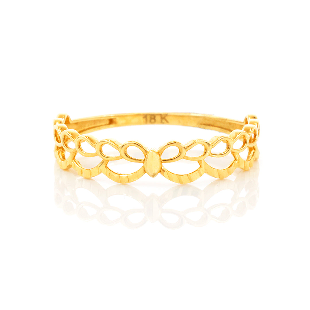Gold bracelet with intricate design on a white background