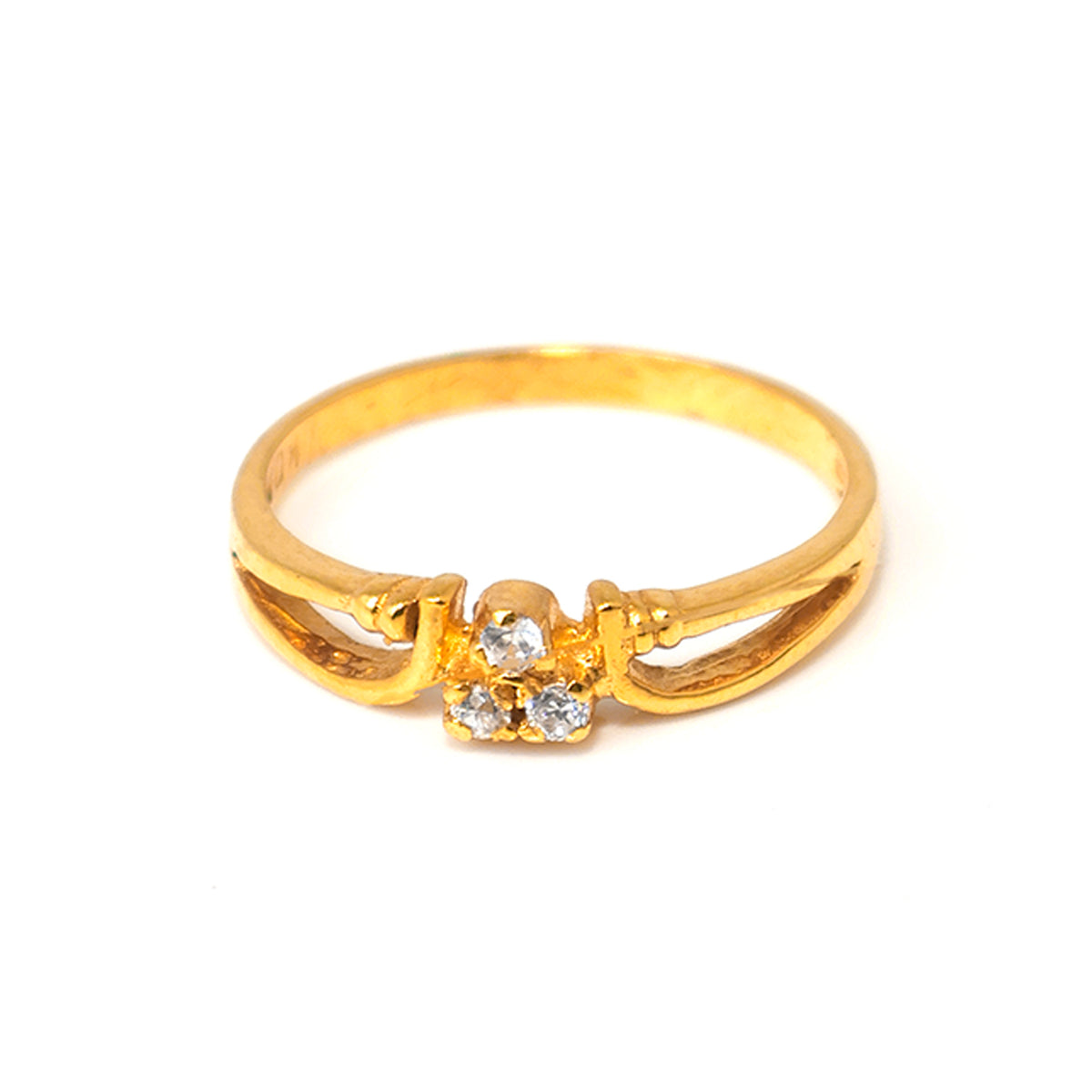 Gold ring with diamond accents on a white background