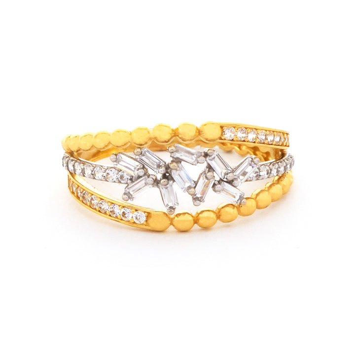 Gold and silver ring with diamond accents on a white background