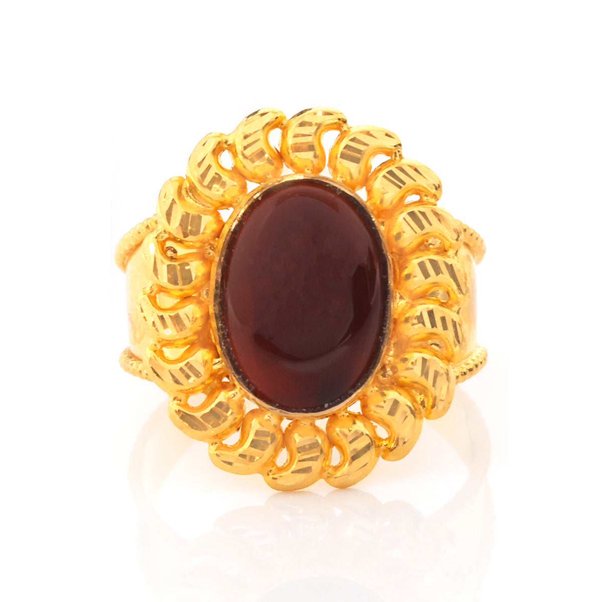 A gold ring featuring a large oval dark reddish-brown cabochon gemstone in the center, surrounded by a textured, openwork gold halo.