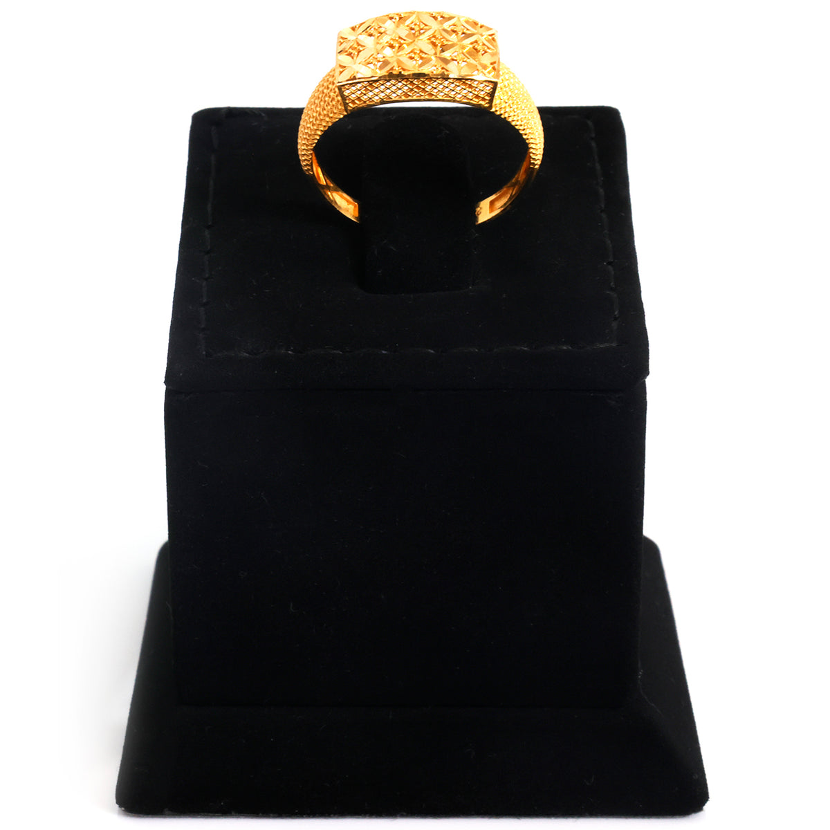 A gold ring with a textured, geometric patterned band displayed on a black velvet ring stand against a white background.