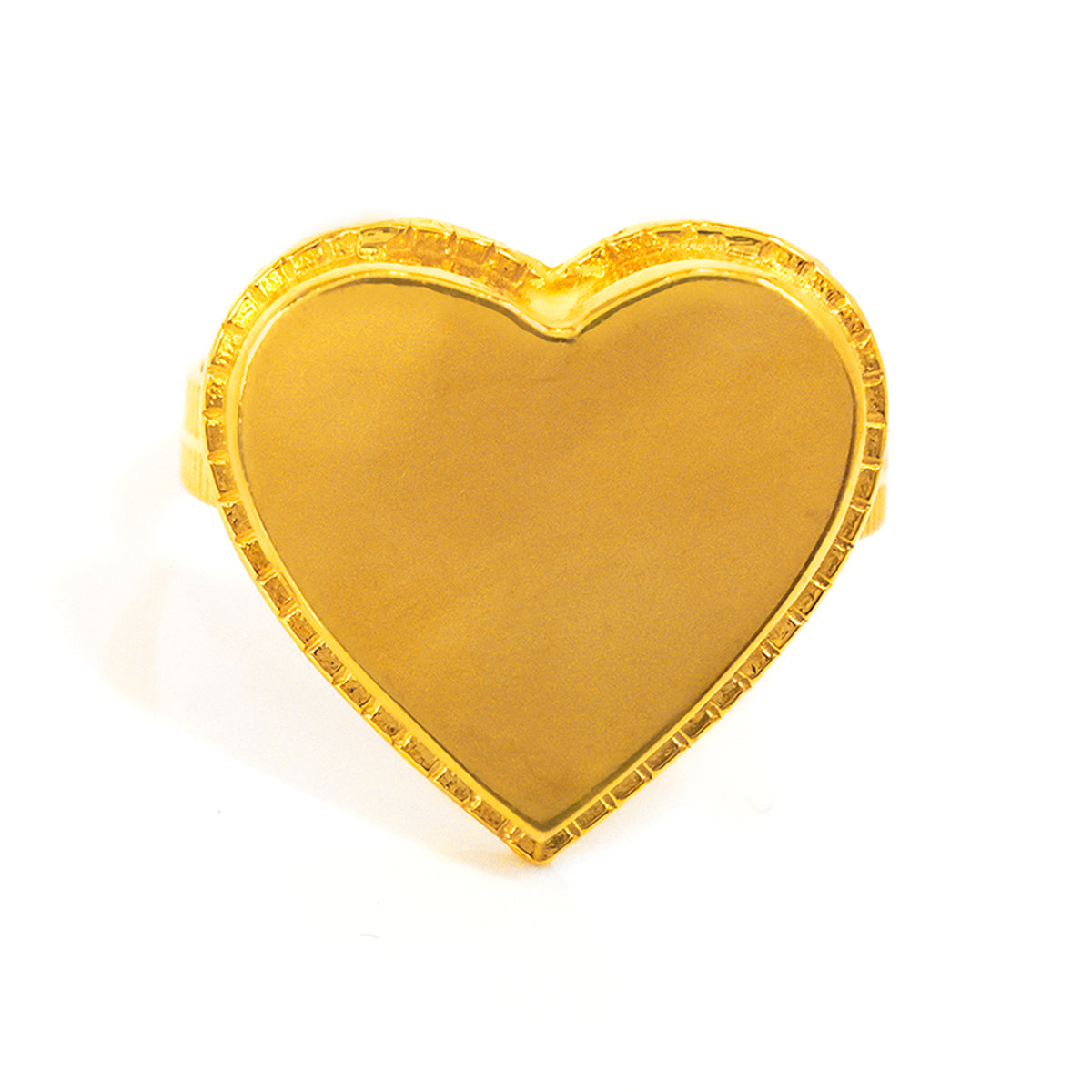 Gold heart-shaped object on a white background