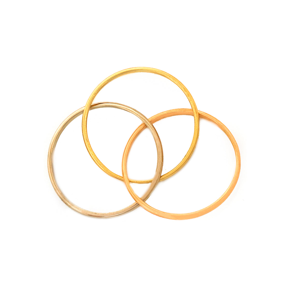 Three ذهب خواتم stacked on white background
