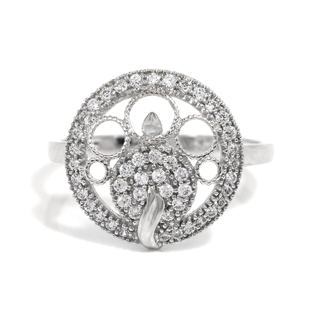 Silver ring with intricate design and embedded stones on a white background