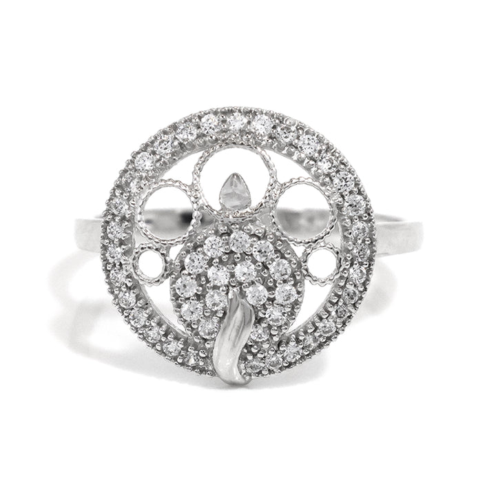 Silver ring with intricate design and embedded stones on a white background