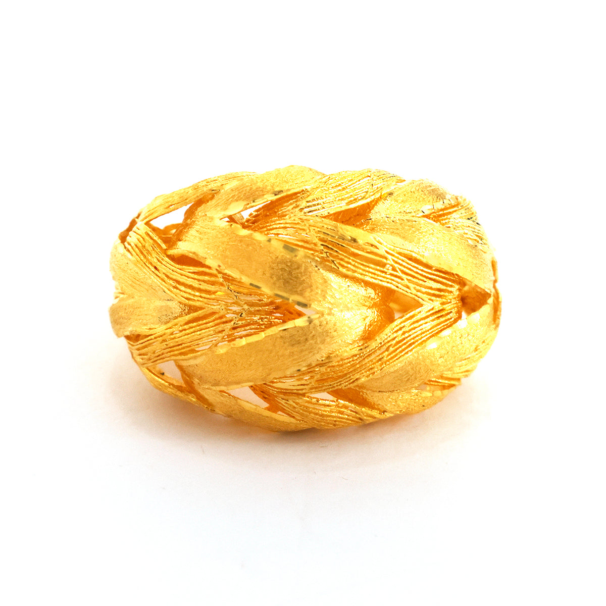Gold ring with intricate design on a white background