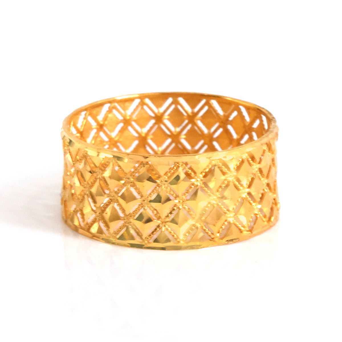 Gold bracelet with a geometric pattern on a white background