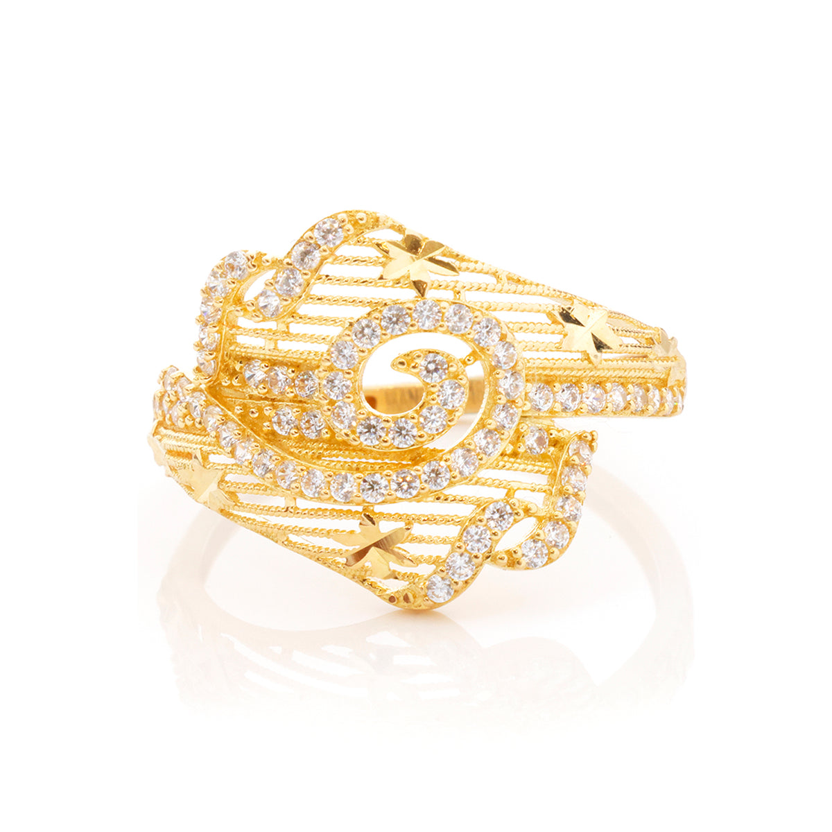 A gold ring featuring a sculptural, multi-layered design paved with clear diamonds, set against a clean white background with a soft reflection.