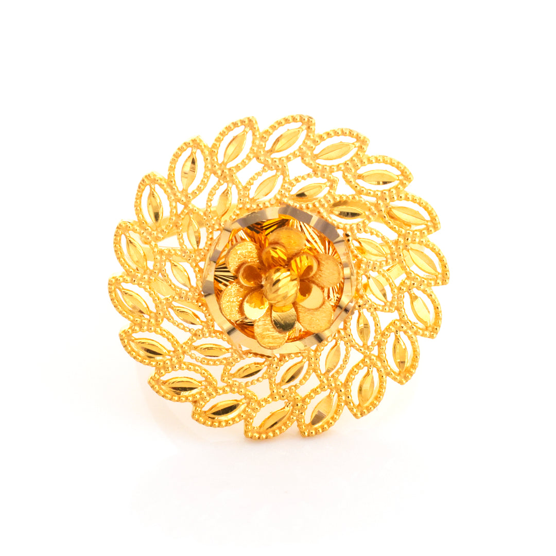 A gold-toned filigree brooch featuring a central flower motif surrounded by an intricate leaf-like openwork border, photographed on a clean white background.