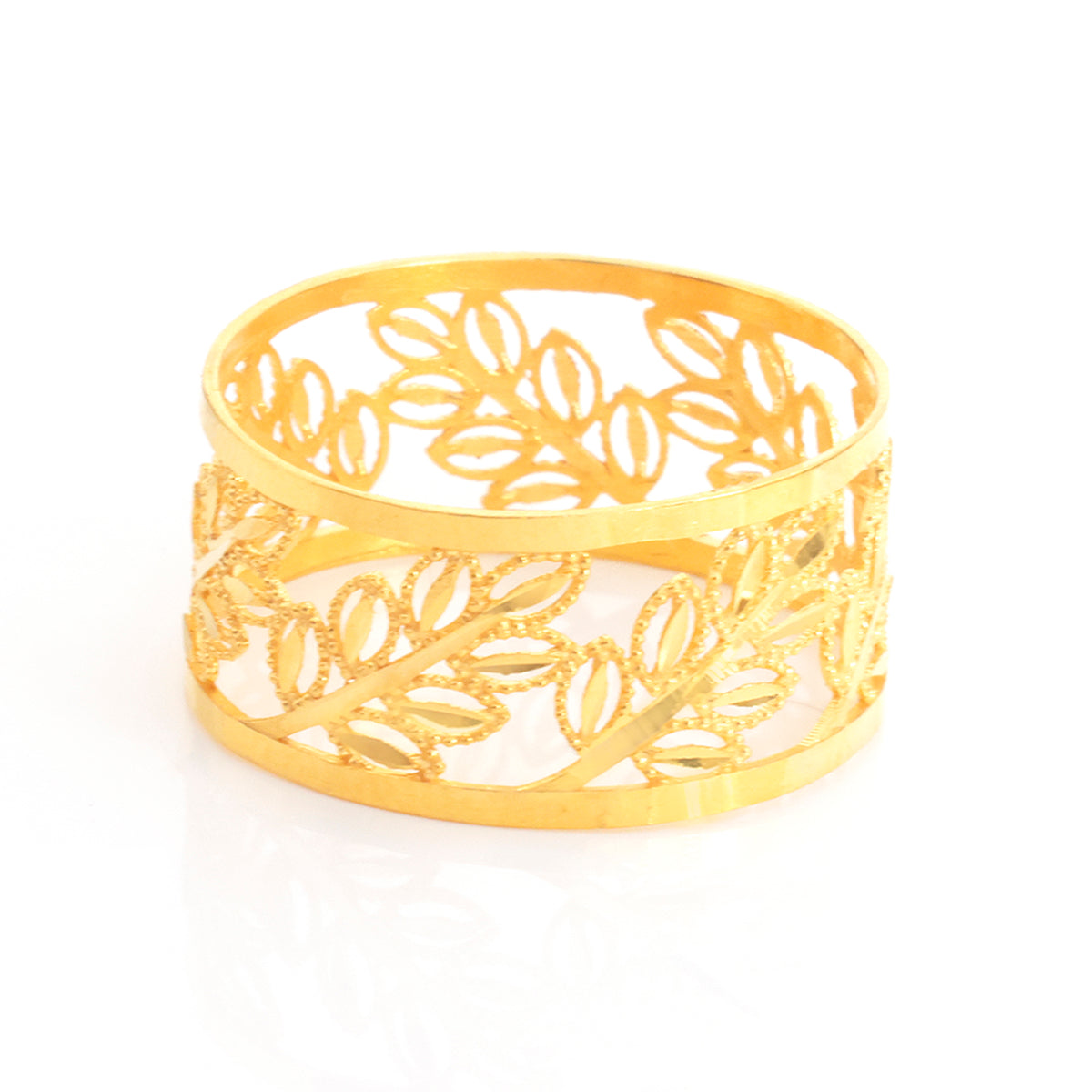 A gold-colored openwork ring featuring a detailed leaf filigree pattern, displayed on a clean white background with a soft reflection.