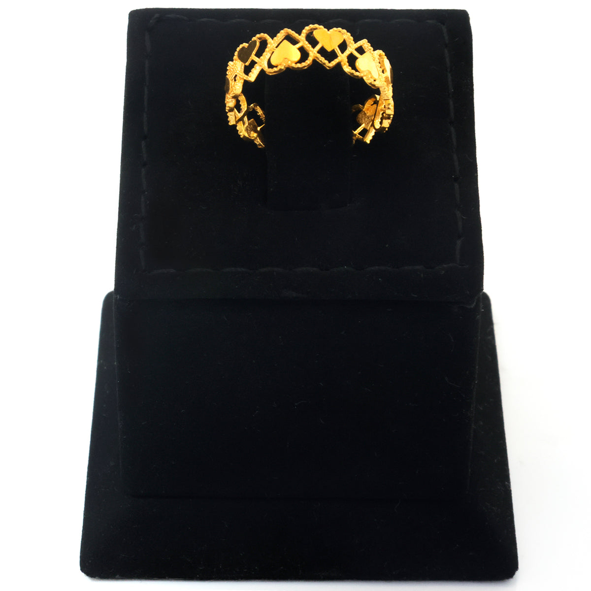 A textured gold ring with an open, interlocking geometric design, displayed on a black velvet jewelry stand against a white background.
