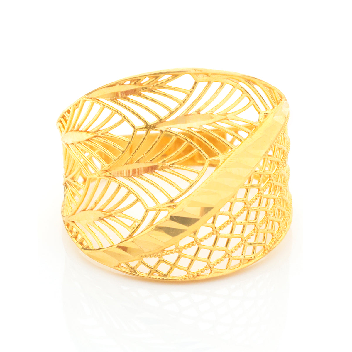 A wide gold cuff bracelet featuring a leaf-inspired openwork pattern with a textured, diamond-mesh lower band, shown on a clean white background.