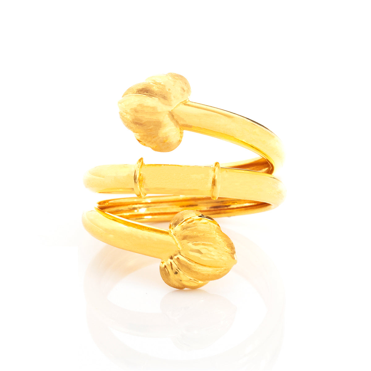 A gold-plated adjustable ring with textured, flower-like loops on the ends, displayed on a clean white background with a soft reflection.
