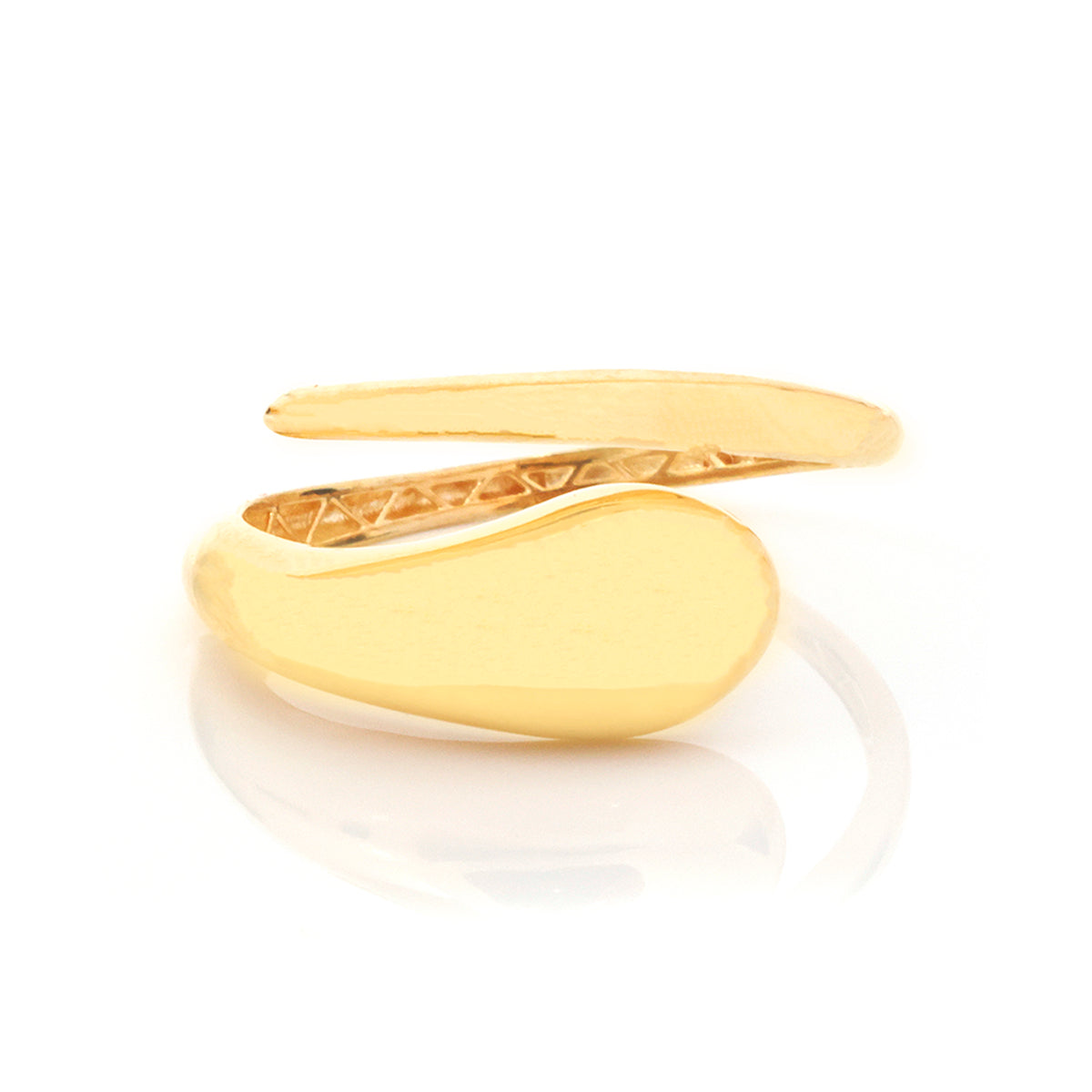 A gold signet ring with a smooth, polished oval face and a textured inner band, displayed on a clean white background with a soft reflection.