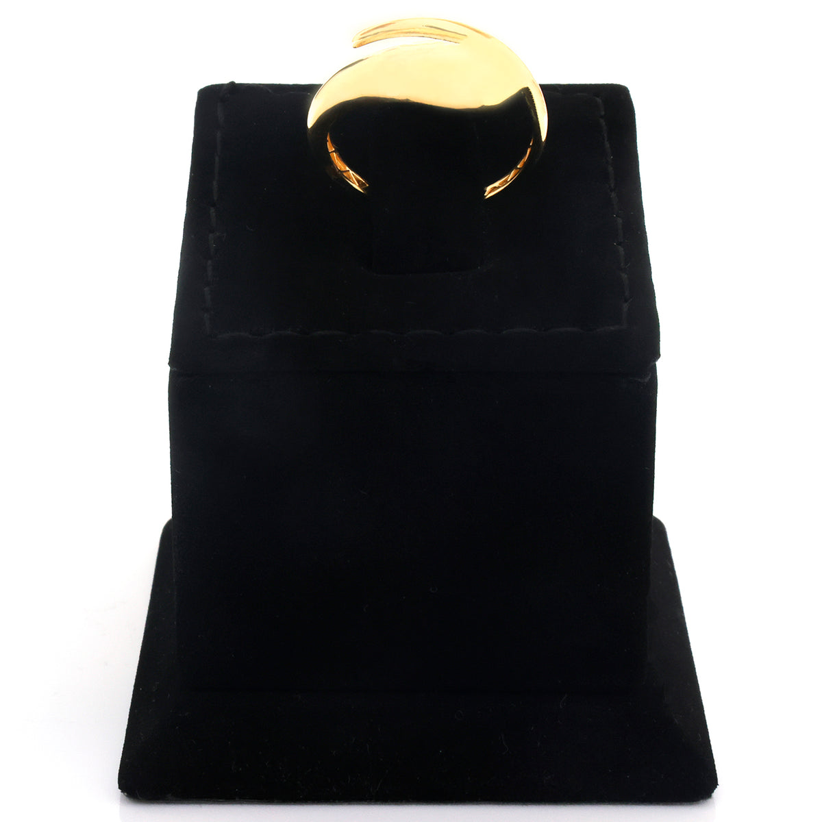 A polished gold ring displayed on a black velvet ring box against a white background.