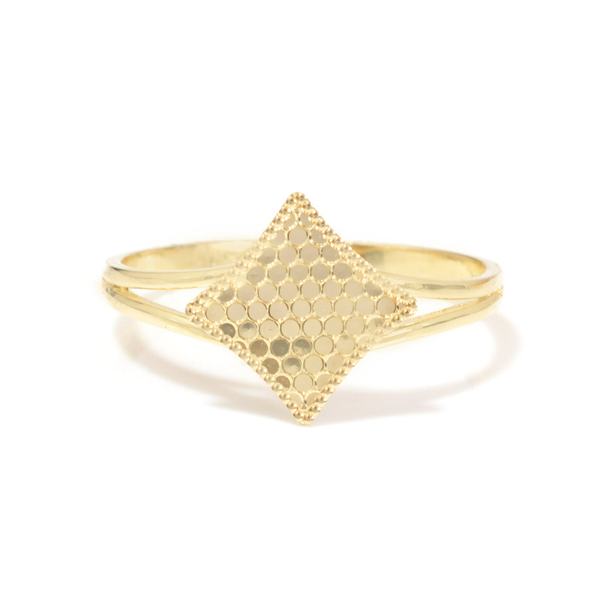 A gold ring featuring a diamond-shaped top with a textured honeycomb pattern on one side and a smooth beaded border on the other, set against a plain white background.